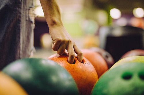 Hand choosing a bowling bowl