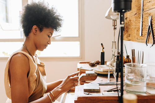 Female doing ornament designing with tools
