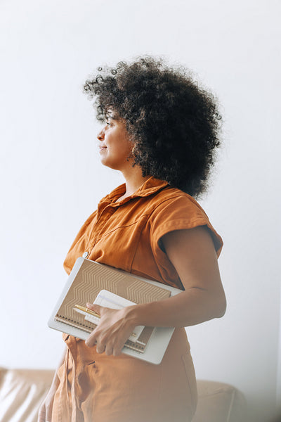 Thoughtful businesswoman standing in a modern office