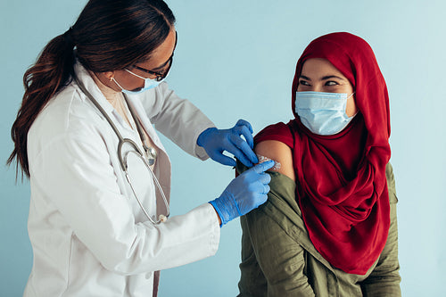 Muslim woman getting covid vaccine