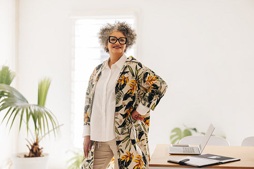 Senior businesswoman standing in a meeting room