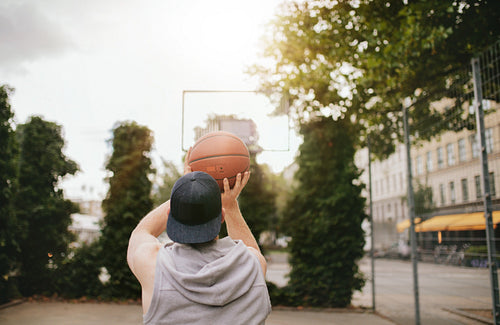 Streetball player shoots basket