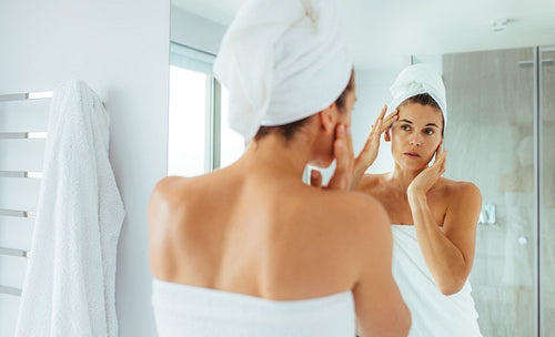 Woman taking care of her body after bath