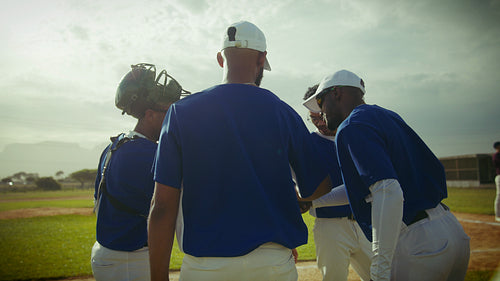 Players greet opponents on baseball diamond