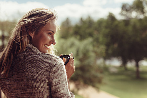 Attractive woman having coffee in morning