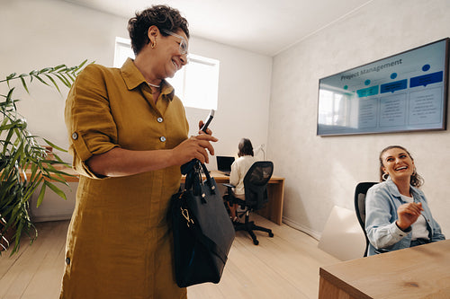 Businesswoman finishing work and heading home from an office meeting