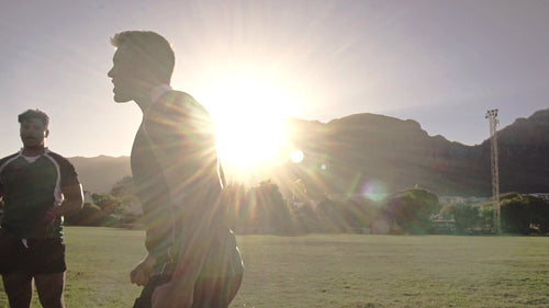 Excited rugby players celebrating the win