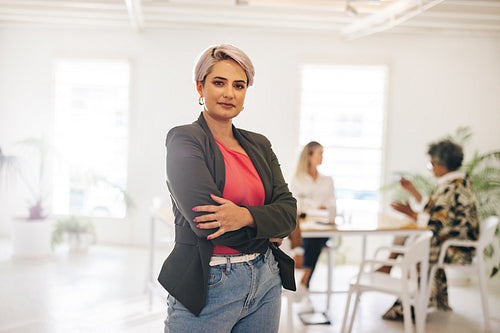 Young businesswoman standing in a meeting room
