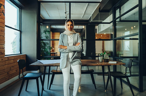 Muslim business professional wearing a hijab in an office