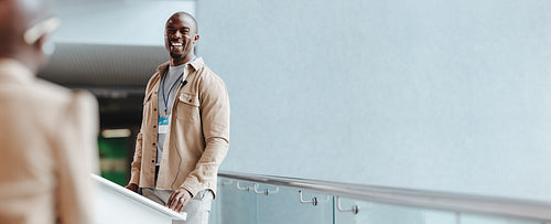 Happy business man engaging with colleagues at a business convention