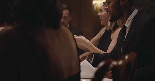 Multiracial having a dinner party