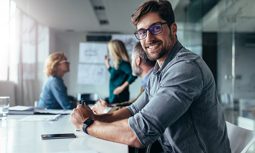 Businessman sitting in board room during presentation