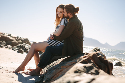 Romantic young couple relaxing on the beach