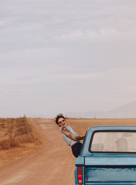 Woman looking excited on road trip