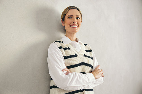 Portrait of a cheerful businesswoman smiling at the camera in an office