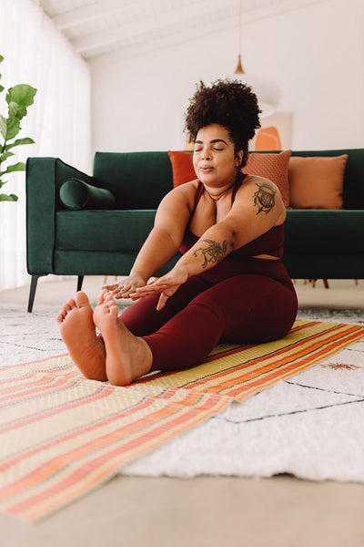 Fitness female doing yoga training at home