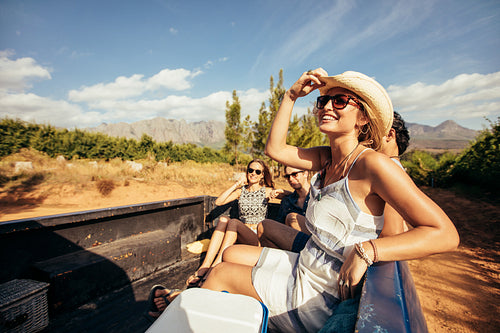 Young friends sitting in a pickup truck