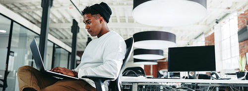 Computer programmer working on a new code in a modern office