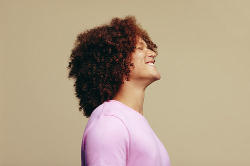 Celebrating his unique beauty, young smiles in a studio