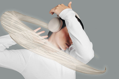 Music and vibes. Woman enjoying listening to a song using headphones