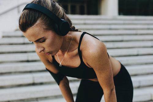 Close up of a female athlete relaxing during workout