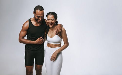 Monochrome portrait of fit man and woman together