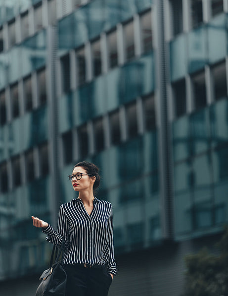 Young businesswoman walking outdoors