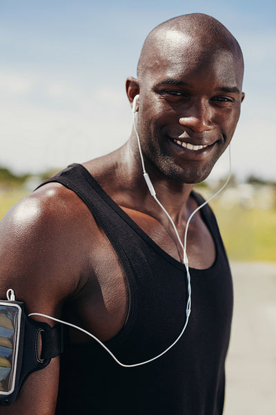 Happy young man wearing earphones