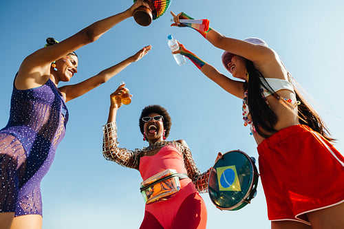 Friends celebrate carnival with drums and drinks