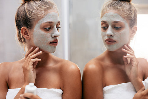 Beautiful female doing beauty treatment after bath