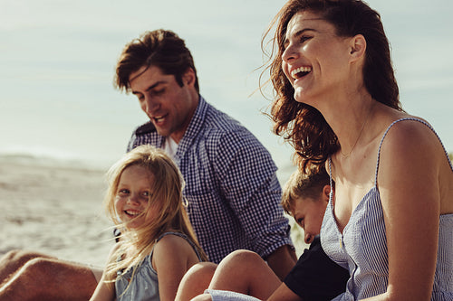 Family relaxing on the beach