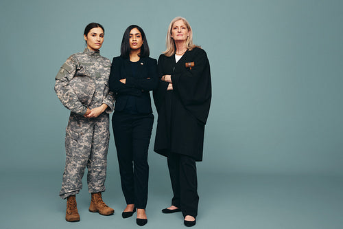Three women from different government professions standing in a 
