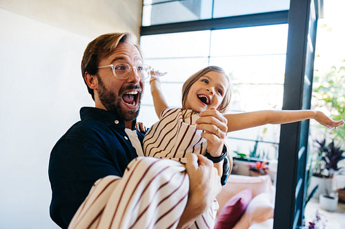 Family moment: dad and daughter indoors