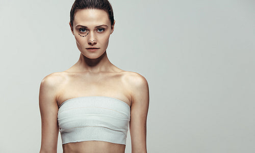 Woman preparing for facial cosmetic surgery