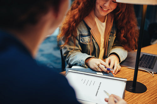 Students discussing their assignment