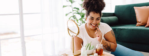 Beautiful woman taking skin care