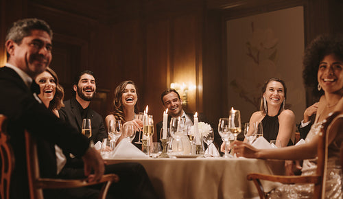 Group of people enjoying dinner party