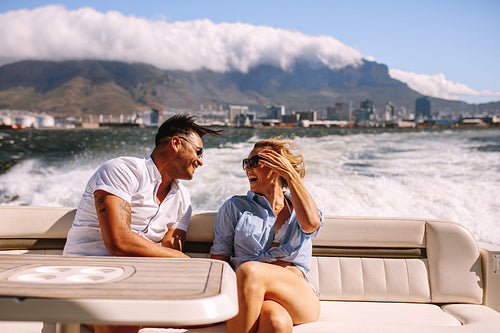 Couple traveling by a boat and laughing
