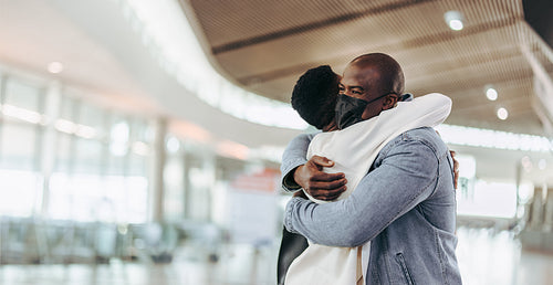 Couple reuniting at airport