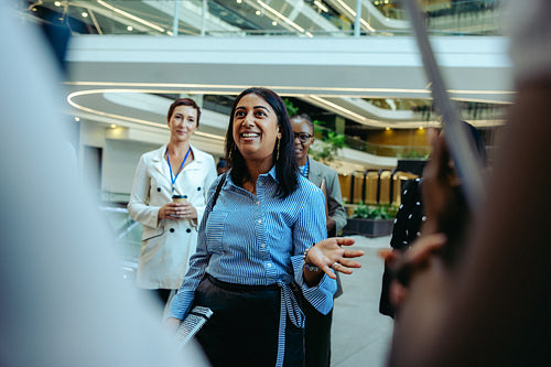 New consultant introduces herself to colleagues in a professional business environment