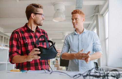 Young developers discussing on new virtual reality glasses