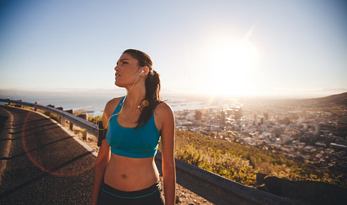 Female athlete taking a break after hard outdoor training