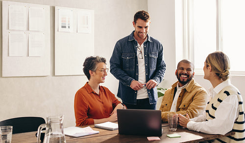Happy designers having a meeting in an office