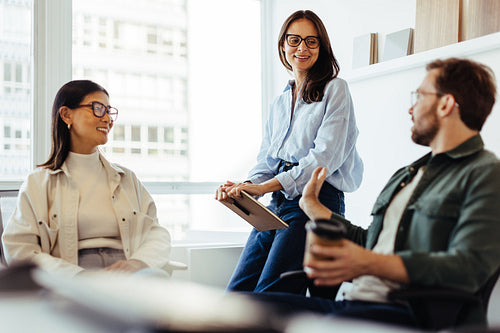 Team of professionals having a discussion in an office