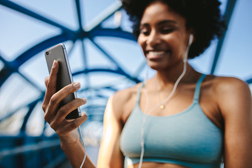 Woman exercising checking app
