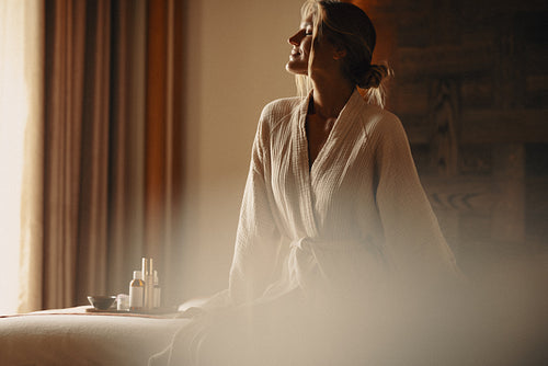 Happy woman enjoying luxury spa at a high-end hotel