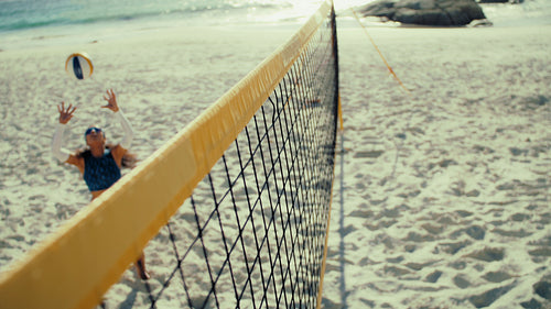 Friendly beach volleyball game between professional teams training for the summer games