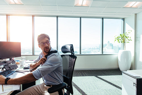 Young entrepreneur working at his desk in office.