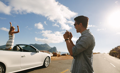 Couple doing a photo shoot on road trip