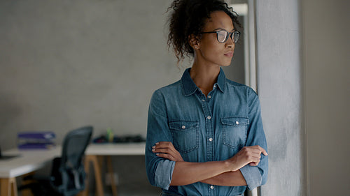 Successful female entrepreneur standing in her office